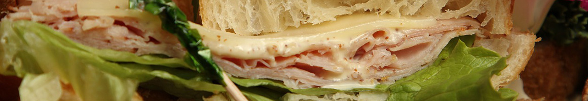 Eating Sandwich at Delaware Subs restaurant in Austin, TX.